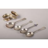 Four Silver spoons and two napkin rings. To include two napkin ring assayed in Birmingham 1924 by MJ