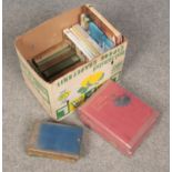 A box of books. Includes Outline of Nature, Charles Dickens, RL Stevenson etc.