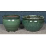 Two glazed Terracotta green planters. H: 34cm, D: 38cm.