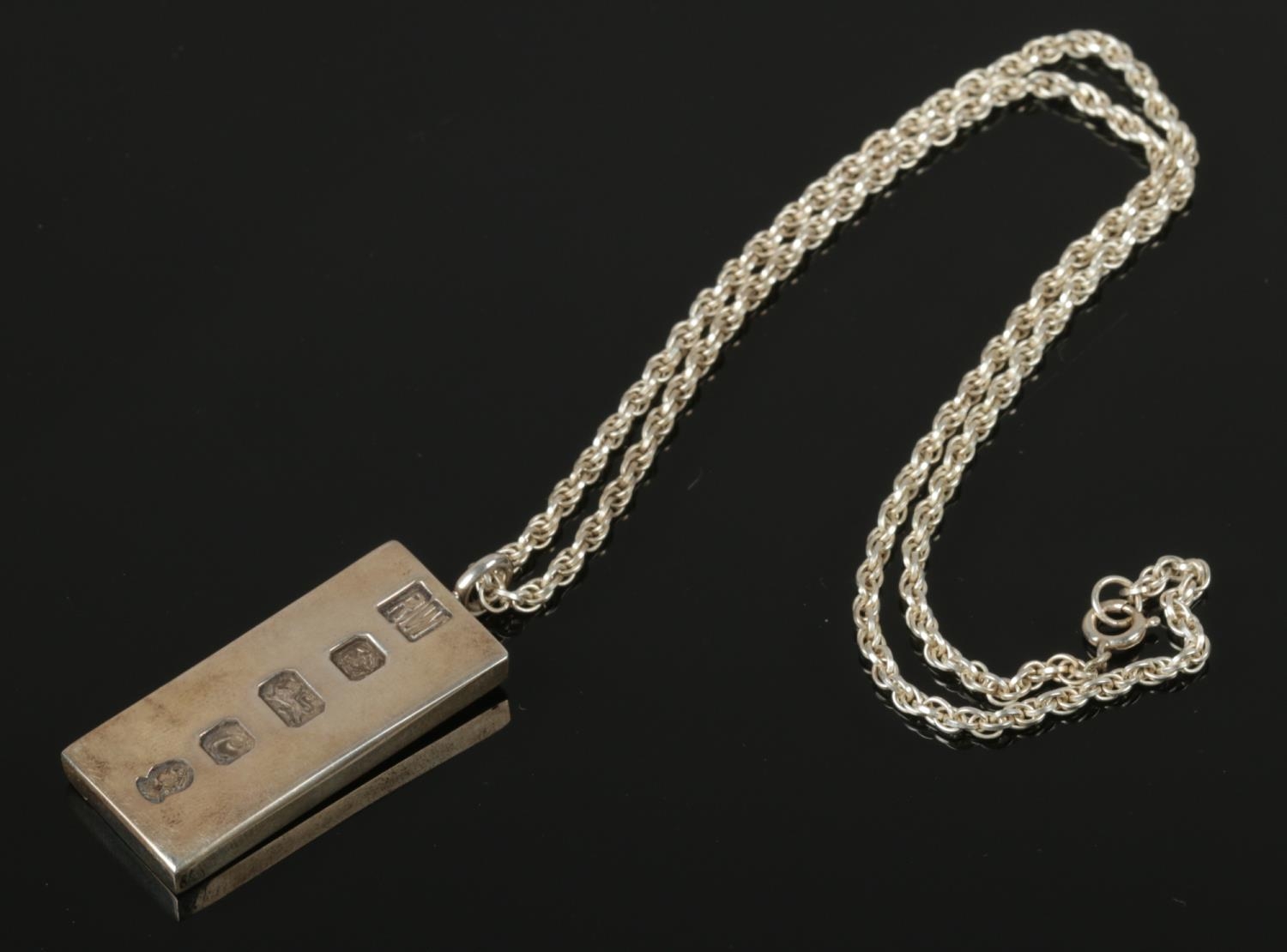 A Silver Ingot Pendant with sterling silver necklace. Assayed in Sheffield 1977 by Ralph Weston.