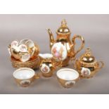 A Bondware Fine China gilt porcelain coffee set.