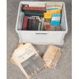 A box of vintage books, annuals and newspapers.