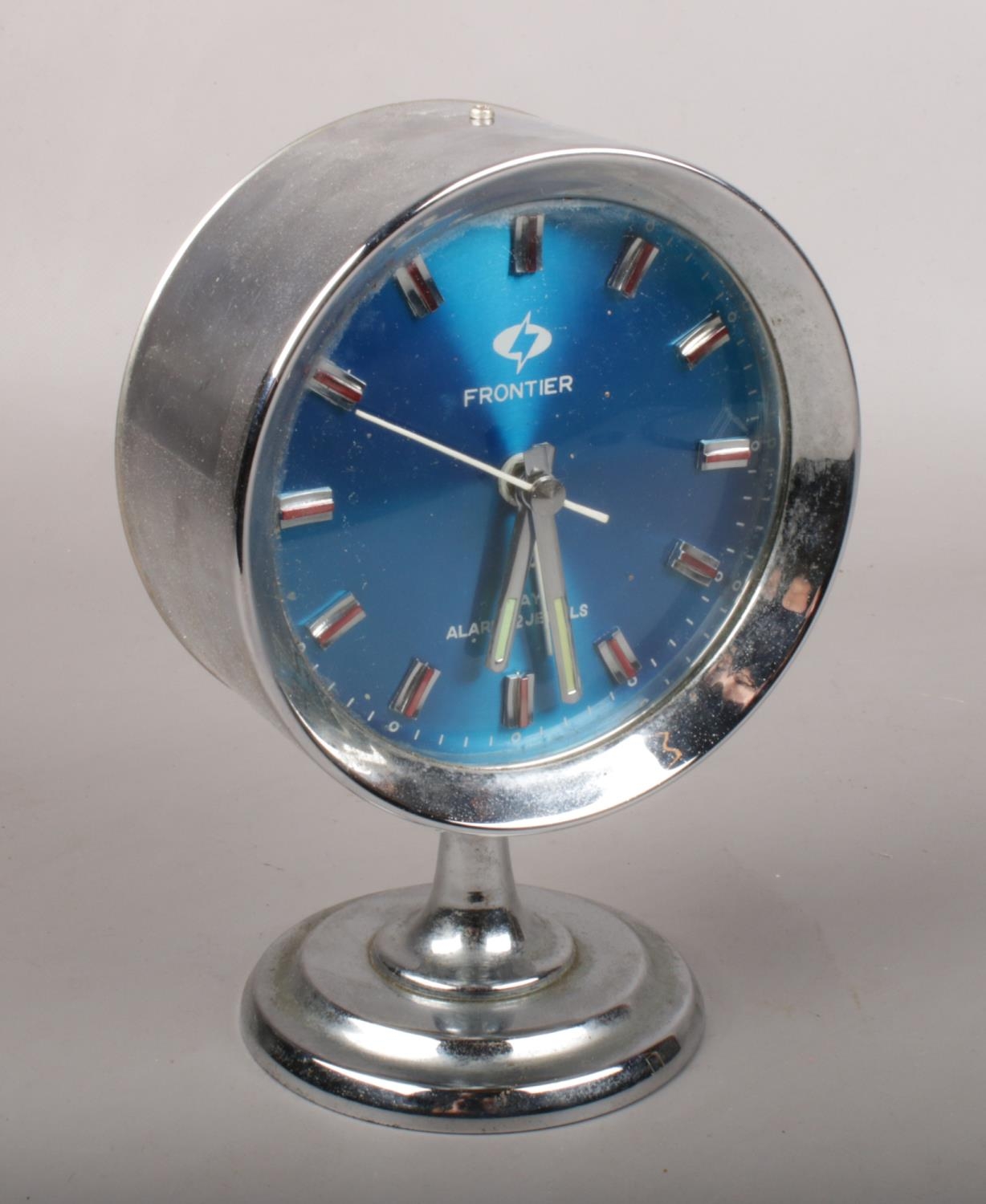 A chrome Frontier 7 day alarm clock.