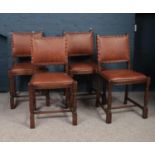 A set of four oak carved studded leather chairs in the refectory style. H:86cm, W: 46cm. Condition