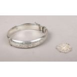 A Silver bangle with engraving detailing. Assayed Birmingham 1968 By CPS Jewellery Co Ltd To include