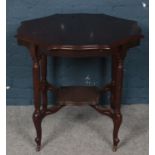 A carved mahogany octagonal window table with scalloped edge. (Diameter 81cm)