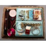 A box of mainly costume jewellery. Includes compacts, Indian jewellery etc.