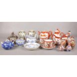 A group of oriental style ceramic's. A pair of Noritake twin handled decorative urns, tea set, vases