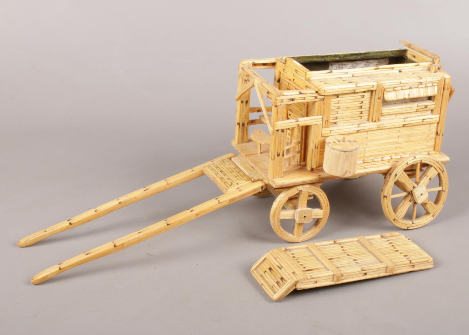 A scratch build gypsy caravan made from match sticks with fitted interior.