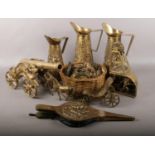 A box of brassware. Including large cannon, graduated jugs, decorative coal mining display,