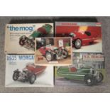Four boxed model kits for the 1935 Morgan three-wheeler, mainly Minicraft. Along with a similar