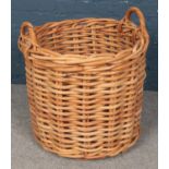 A Large Round Twin-Handled Wicker Basket. Dimensions: Height = 57cm, Diameter = 60cm.