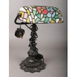 A Tiffany style desk lamp.