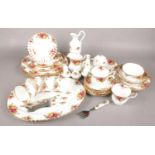 A Thirty-Five Piece Royal Albert Country Roses Dinner Set. Includes Teacups and Saucers, Salt and