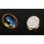 A Limoges French Enamel Brooch, depicting a female highlighted in blue, signed to the reverse "H.
