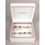 Eight Sterling Silver (925) discontinued Pandora charms in original box.