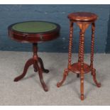 A circular drum table along with a hardwood jardinière stand.