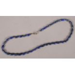 A Lapis Lazuli bead necklace with silver clasp.
