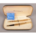 A Waterman's Gold Plated Fountain Pen and Ballpoint Set, in the Crocodile Model. 1976. Embossed with