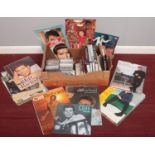 A box of assorted Cliff Richard memorabilia. Calendars 1996 -2010, various books The Biography, Me