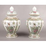 Two ceramic decorative ginger jars. 43cm height.
