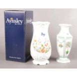 Two Aynsley vases. To include a boxed 'Cottage Garden' vase H: 26.5cm, and a 'Victorian Garden'