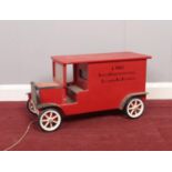 A wooden pull along toy vehicle. (J. Rust, Outftr. & Floorcoverngs, Bircotes)