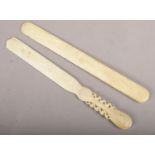 Two Victorian ivory page turners. One with carved handle.