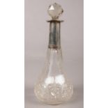 A silver collared glass scent bottle. The markings are very worn so unable to tell where assayed. H: