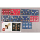 A collection of British pre decimal coin sets. Includes Threepences, Sixpences, etc.