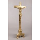 A brass alter figure of Christ on the cross. H: 45cm, W: 16cm.