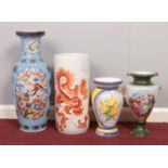 A group of four large ceramic vases. various sizes.