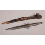 A Fairbairn Sykes pattern Commando fighting knife: straight double edged blade over one piece hilt