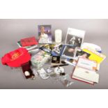 A collection of Cliff Richard memorabilia. Photographs, pin badges, cd's, concert tickets, candle