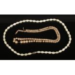 Two Pearl Necklaces, one with 9ct Gold Clasp. Condition Fair, String on one of the necklaces has