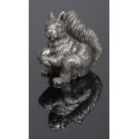 A hallmarked silver model of a squirrel, 35.6g. 4.5cm tall.