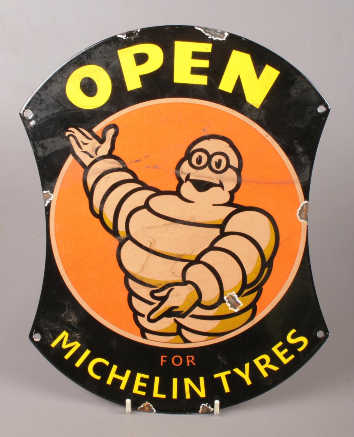 A reproduction enamelled metal advertising sign for Michelin Tyres.