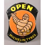 A reproduction enamelled metal advertising sign for Michelin Tyres.