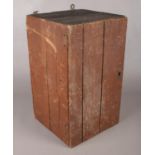 A small wall mounted wooden cabinet with contents of brushes. (46cm x 27cm)