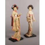 A pair of Chinese decorative dolls.