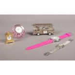 A group of clocks/wristwatches. Caithness glass/clock paperweight, fire engine model quartz clock