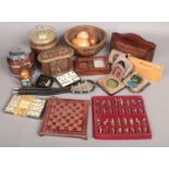 A box of collectables. Including chess set, treen, dominoes, etc.