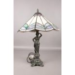 A Tiffany style table lamp with base depicting a female form. 61cm h.