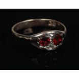 A Victorian 9ct gold garnet & diamond ring. Size O, Gross weight 2.21g.