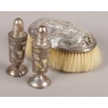 A Silver Topped Brush Assayed for London 1881 by Rosenthal, Jacob & Co, along side Two Pepperettes