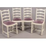 Four painted ladderback dining chairs with amethyst upholstered seats.