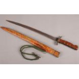 A short sword with oriental style scabbard. marked W.T. & S England.