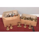 Two boxes of metalwares. Various Brass bells