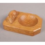 A Robert Thompson 'Mouseman' carved oak pin dish. (10.5cm x 7.5cm)