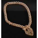 A 9ct Gold Link Bracelet with Heart Locket. Both the Locket and every Link Embossed 9ct. Total
